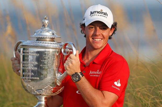 Rory McIlroy of Northern Ireland lifts the Wanamaker Trophy after capturing the PGA Championship at The Ocean Course on Kiawah Island, South Carolina, August 12, 2012. REUTERS/Mathieu Belanger (UNITED STATES – Tags: SPORT GOLF)