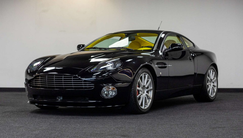 THIS PICTURE: 2007 Aston Martin V12 Vanquish S 2+2 Ultimate Edition - Unregistered - 522km - guide price £150,000 - £170,000 --- SEE SWNS STORY SWNAcars --- A sleek Aston Martin with an eye-popping interior is a highlight of an unusual car auction. The sale features dream cars that have very low mileage - including a 2007 Vanquish in shocking yellow. The V12 Ultimate Edition - guide price £150,000 - £170,000 - has only 522 kilometres on the clock. It was purchased by an anonymous owner and put on private display for fifteen years.