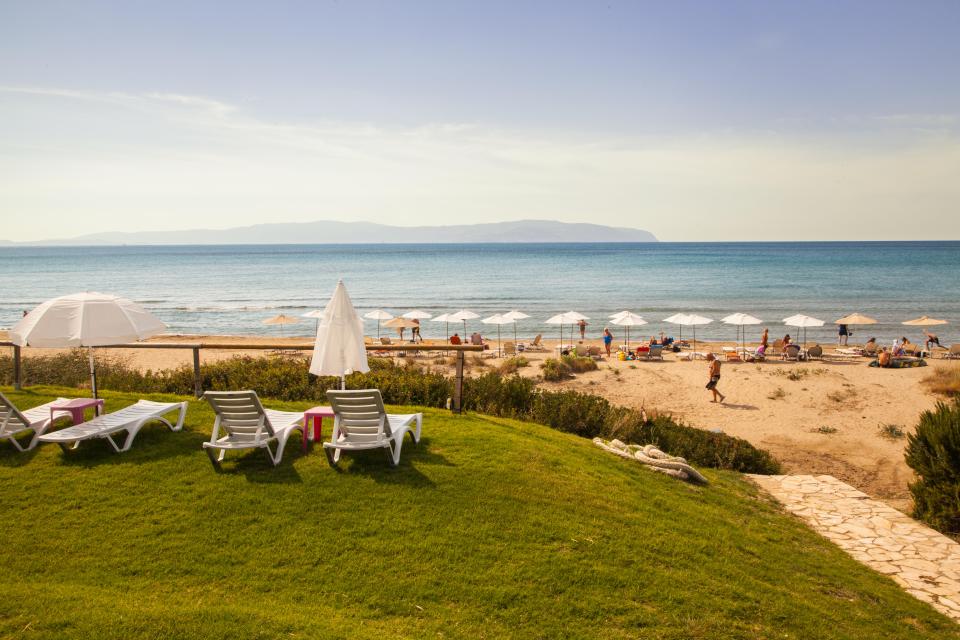 It has sandy beaches as well as a string of Greek Tavernas