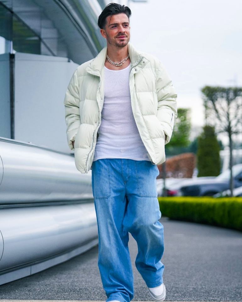 Jack Grealish was pictured out in baggy jeans, a necklace and white jacket