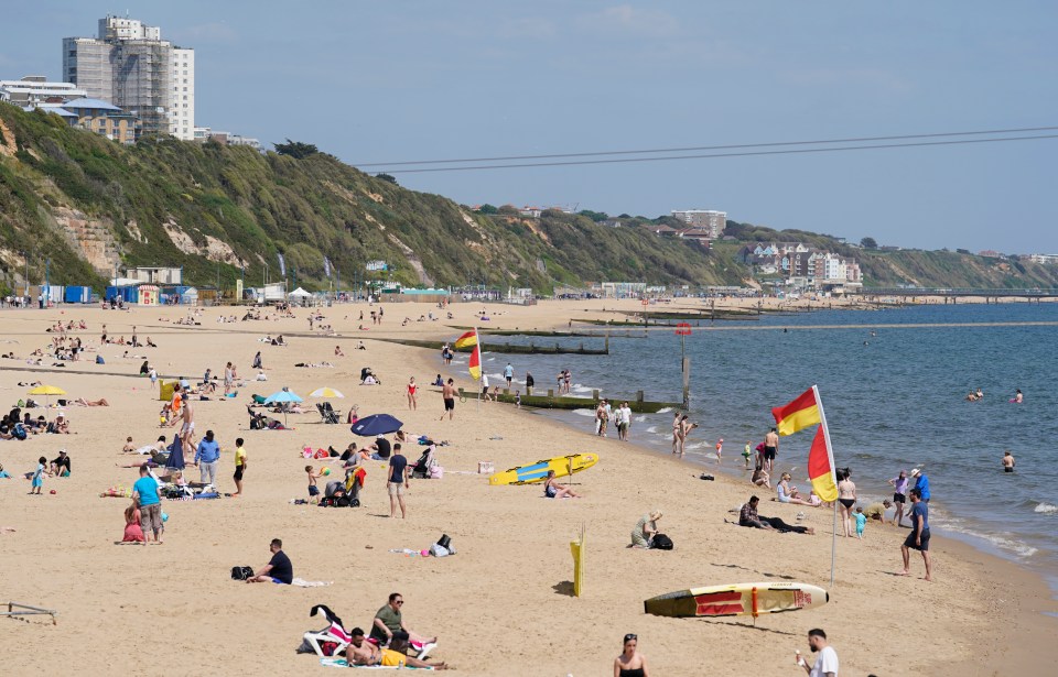 Others were out enjoying the warm weather on Bournemouth beach in Dorset