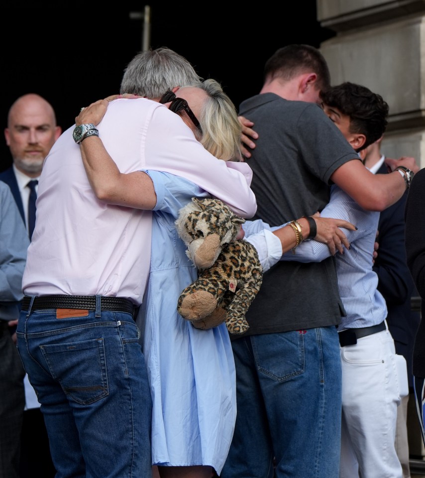 The families of all three victims embraced each other