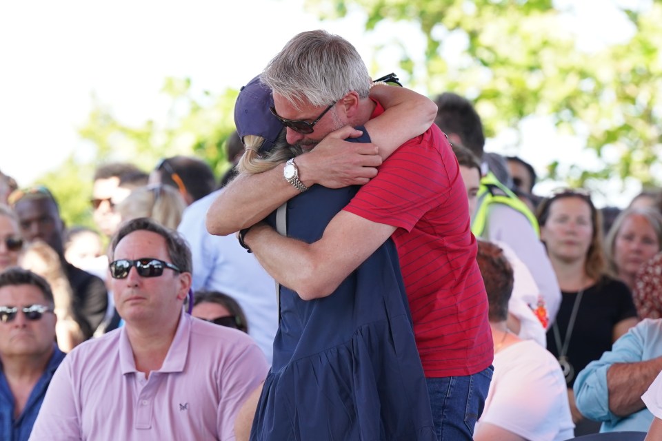 Barnaby's dad David embraced Grace's mum at the vigil