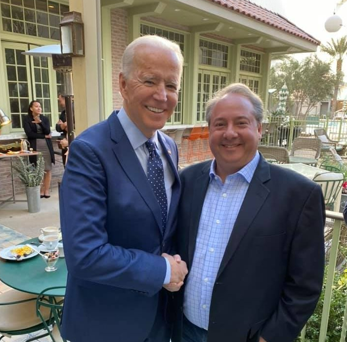 Jay Bloom - pictured with US president Joe Biden - was offered seats on Titan