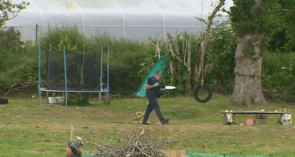 Detectives work at the scene of the fatal shooting of the schoolgirl