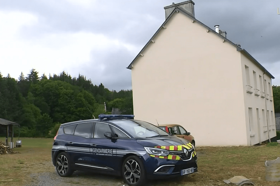 Cops outside the Brit family's home in the hamlet of Saint-Herbot
