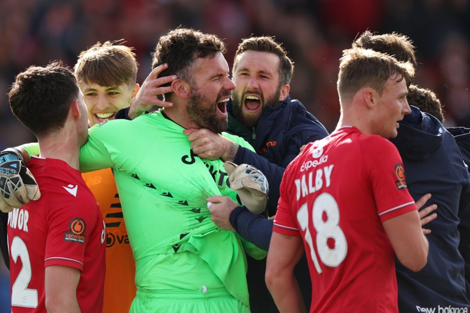 WREXHAM, WALES - APRIL 10: Ben Foster of Wrexham celebrates saving a penalty in the last minute to secure a 3-2 victory during the Vanarama National League fixture between Wrexham and Notts County at The Racecourse Ground on April 10, 2023 in Wrexham, Wales. (Photo by Matthew Ashton - AMA/Getty Images)