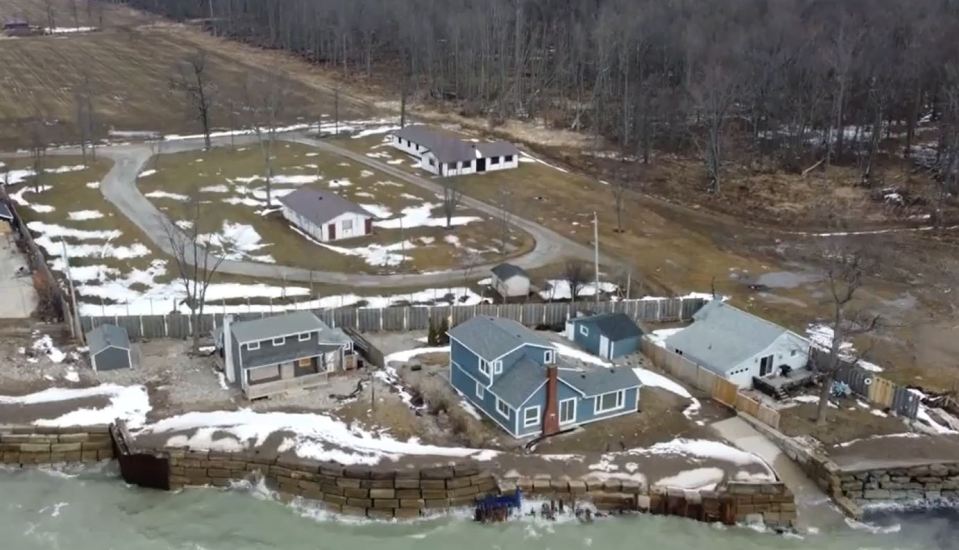 An aerial photo showing the massive fence line blocking in the man's home