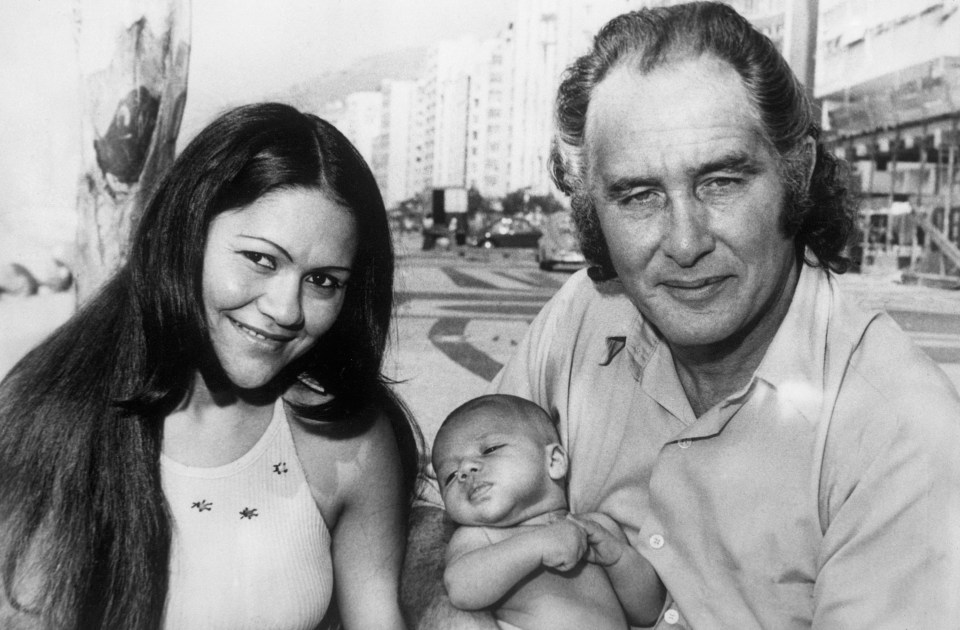 Ronnie with partner Brazilian beauty, Raimunda Nascimento de Castro and baby  - who helped the fugitive remain a free man