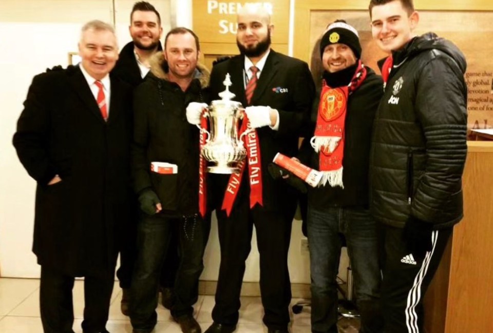 Eamonn Holmes with his family and the FA Cup