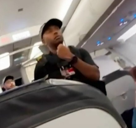 Police stormed a TUI flight from Kos to Manchester Airport on Wednesday