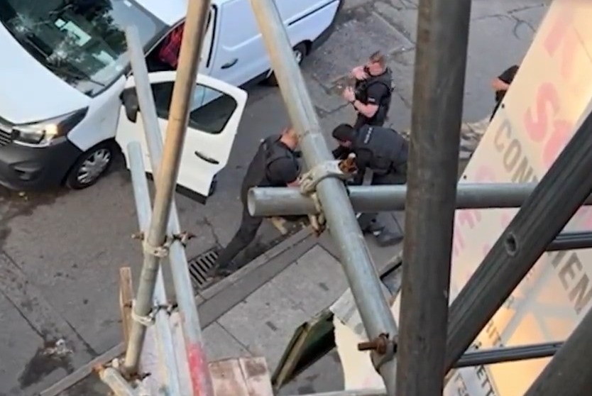 Pictures of the arrest show a white Vauxhall Vivaro with two cracks in the windscreen as cops detained the suspect