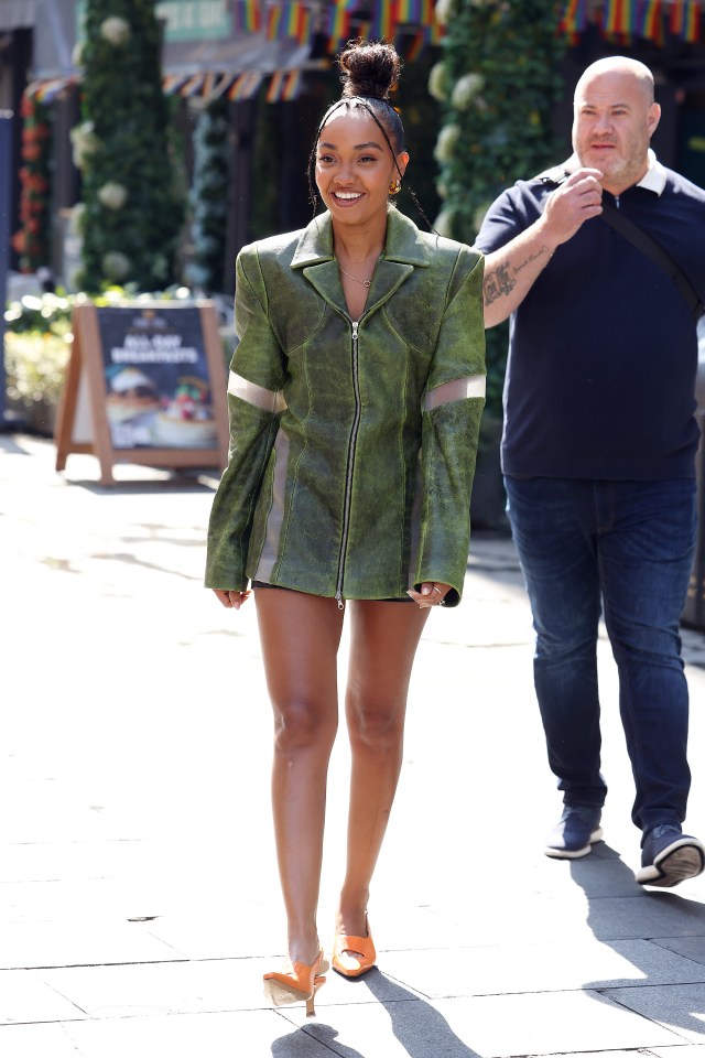 She looked stunning in a green leather zip up jacket dress