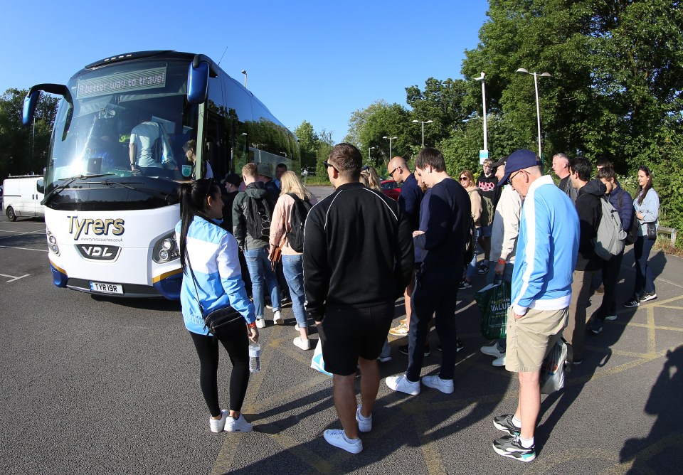 Fans in Manchester pile onto busses to head to Wembley