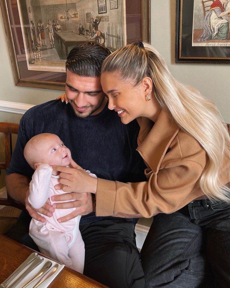 The happy couple with their daughter
