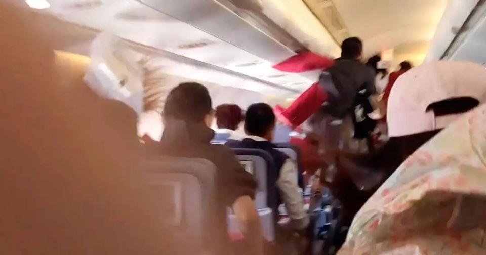 As the plane plunges downwards, passengers and crew were flung into the air
