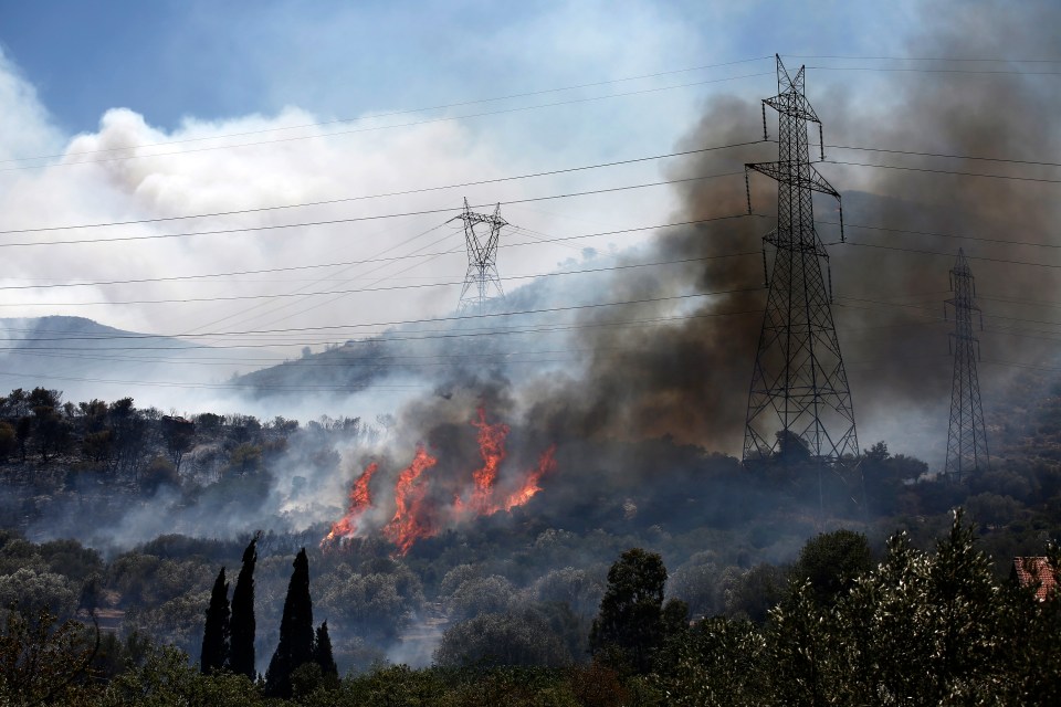 The blaze started in Kouvaras - 30 miles from the Greek capital