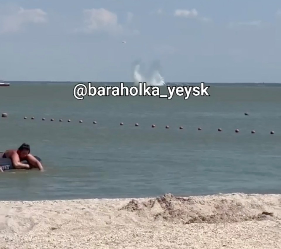 The warplane made a spectacular splash as it hit the water near a tourist beach