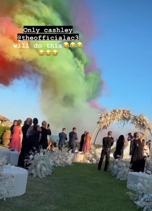 A plume of colourful smoke erupted over the couple