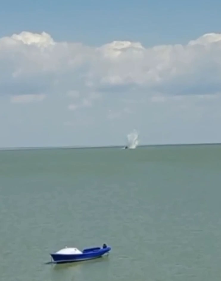 The jet smashed into the water as horrified beachgoers watched on