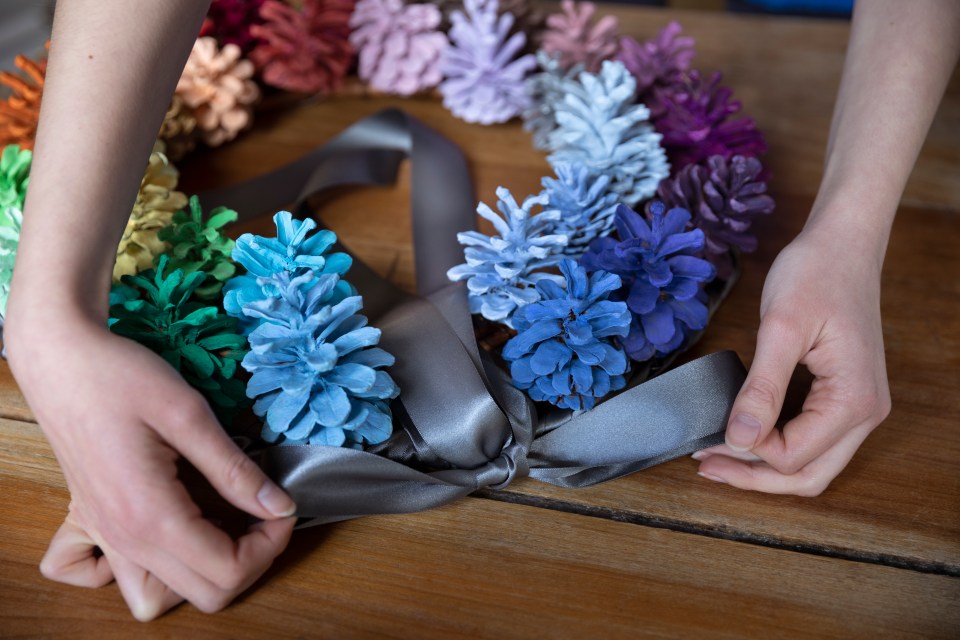 She used some pine cones to create decorations for the tree