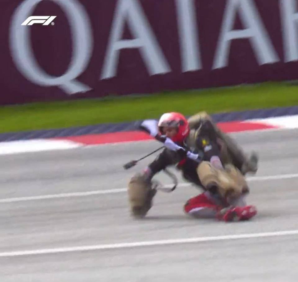 A performer in a jet pack was seen crashing on the track before the Austrian Grand Prix