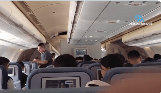 Passengers that were thrown out of their seats rush to strap back in