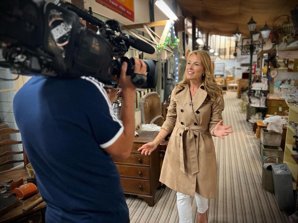 BBC's Christina Trevanion has been hailed the ‘most beautiful woman on TV’ as she posed in a ‘flasher mac’ on the Bargain Hunt set