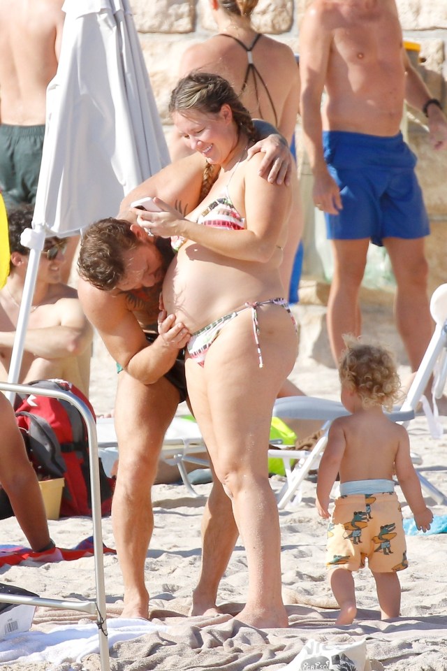 The UFC star even showed some love to her pregnant belly
