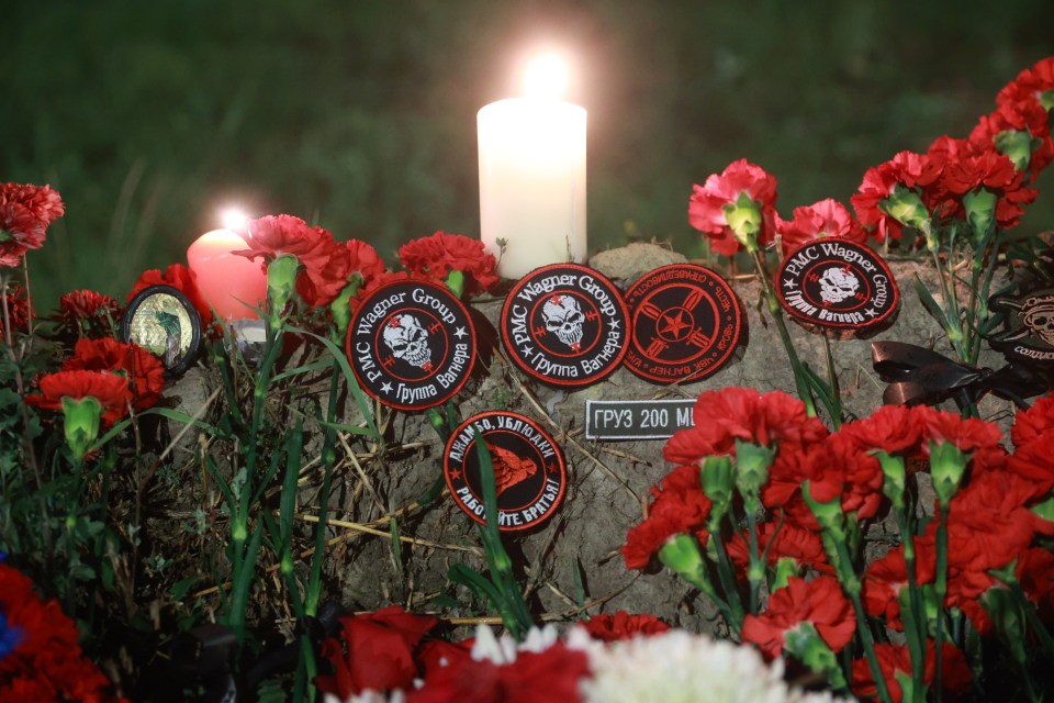 Flowers and patches of the logo of Wagner have been left in St Petersburg