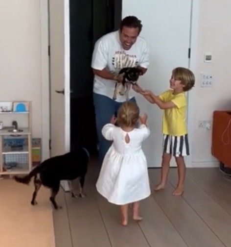 Spencer and Vogue's children gathered around Bertie at the door