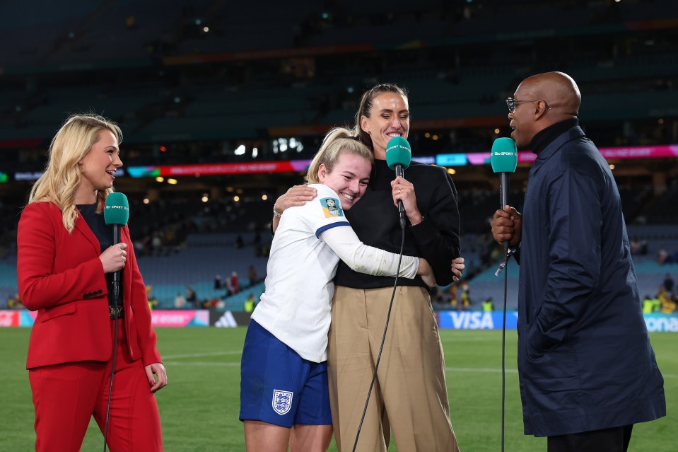 SYDNEY, AUSTRALIA - AUGUST 12: Lauren Hemp of England hugs Jill Scott alongside Ian Wright after the FIFA Women's World Cup Australia & New Zealand 2023 Quarter Final match between England and Colombia at Stadium Australia on August 12, 2023 in Sydney, Australia. (Photo by Catherine Ivill/Getty Images )
