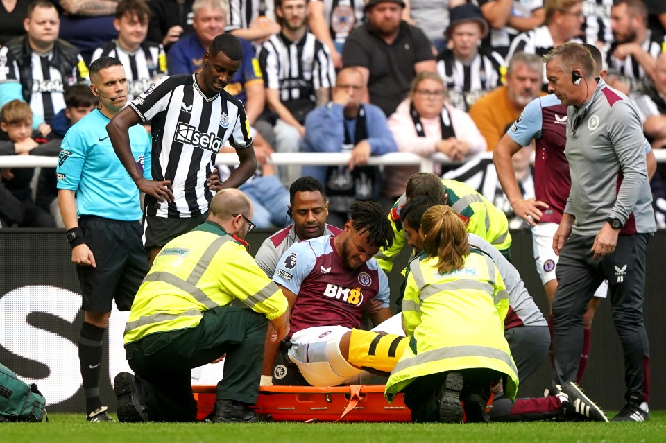 A protective boot was fitted around Tyrone Mings' leg in worrying scenes