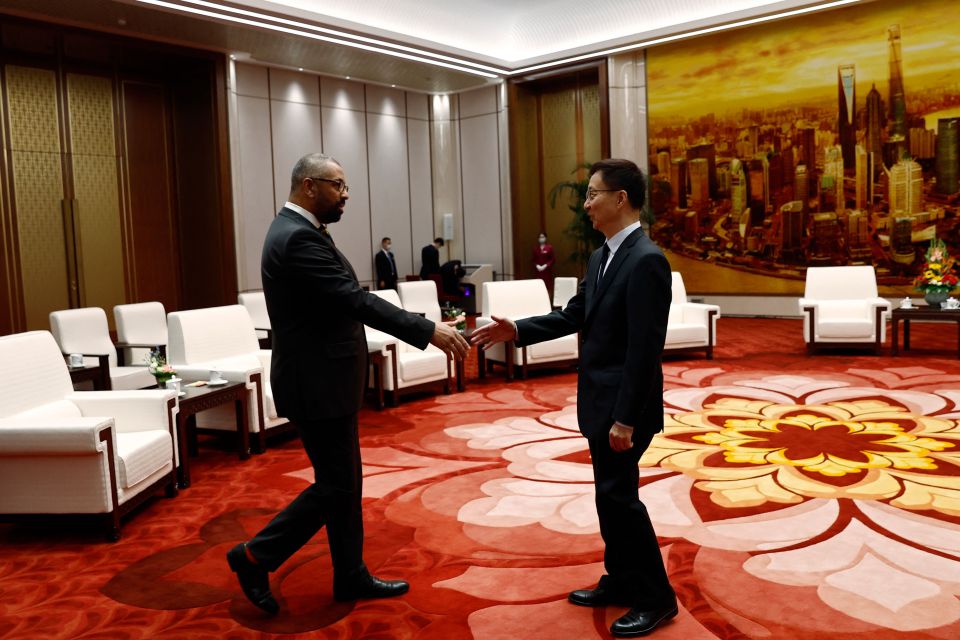 Foreign Secretary James Cleverly and Chinese Vice President Han Zheng shake hands before a meeting at the Great Hall of the People in Beijing