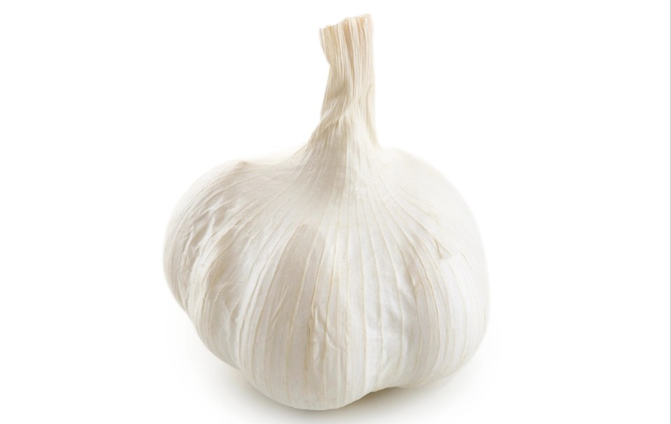 a close up of a garlic bulb on a white background
