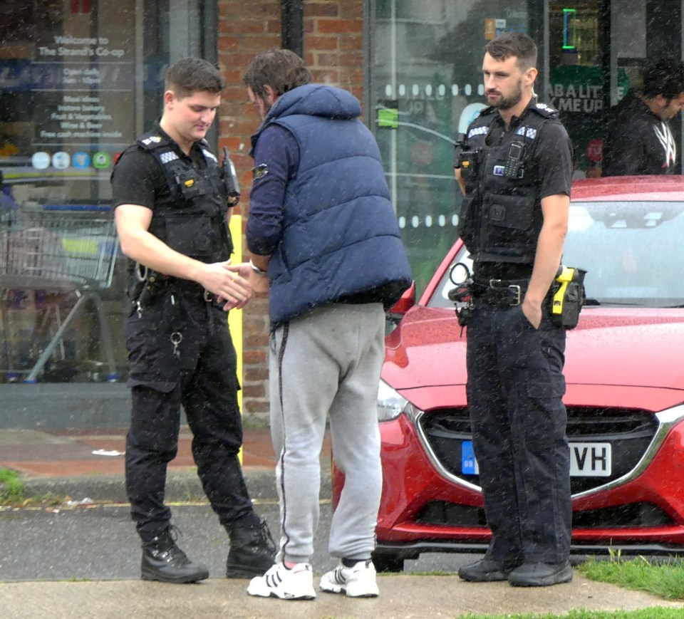 SOS FEA- Durrington South, near Worthing, which statistically has one of the highest shop-lifting crime rates in the uk. Feature focus on field place parade and the shops in the vicinity. Police talking with a man outside the Co-op store., when the sun arrived to interview locals. ***** There is no suggestion the man is a shop lifter***** The man and any children featuring in pics used must have faces pixelated****!!!!!