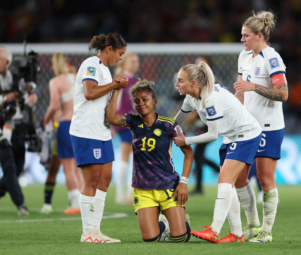 Jorelyn Carabali of Colombia was comforted by Jessica Carter, Alex Greenwood and Millie Bright