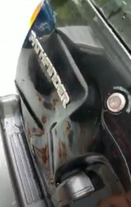 A brutal dent on this Nissan Pathfinder's boot was cured using the cheap hack