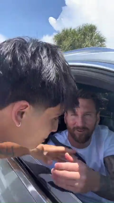 Young football fan eagerly approached the football legend's car