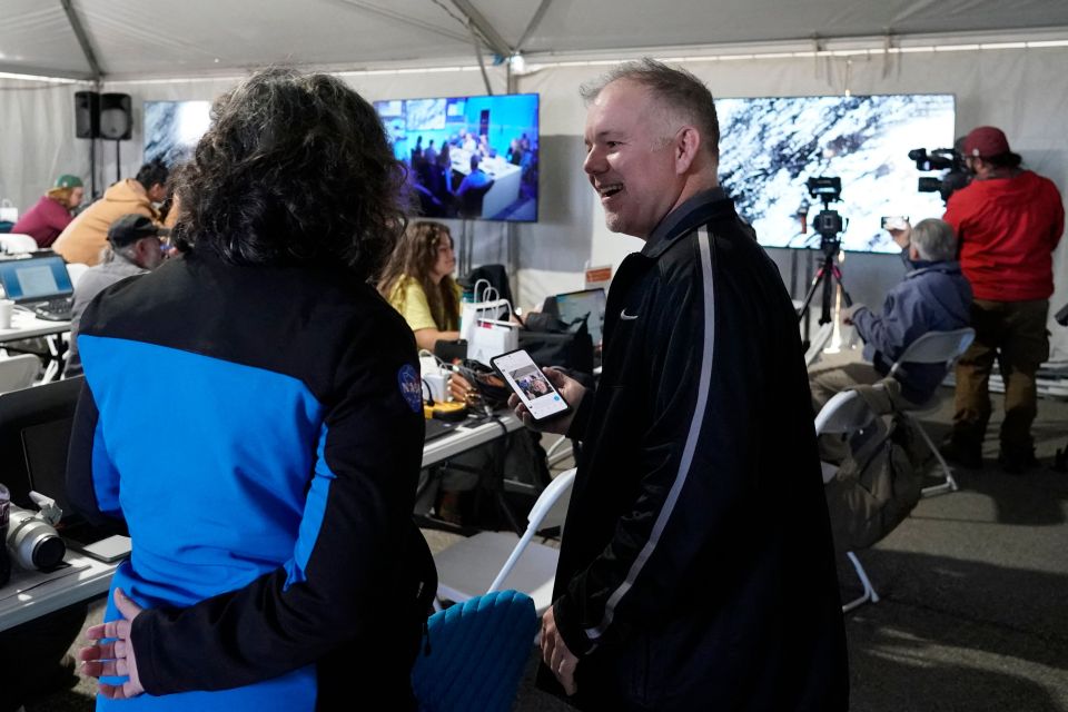 Nasa scientists celebrated the successful landing from the control room