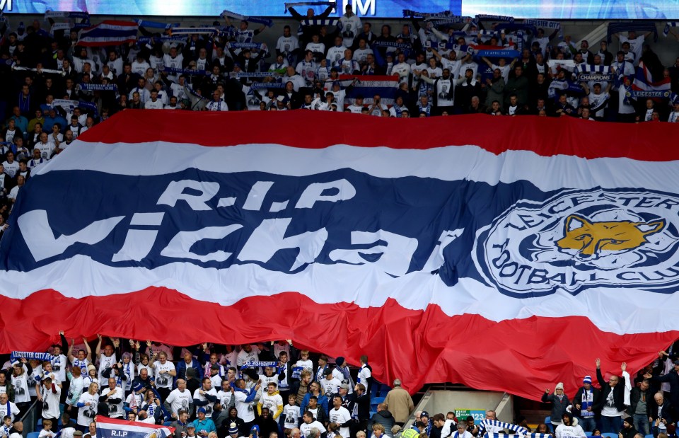 CARDIFF, WALES - NOVEMBER 03: Leicester City fans commemorate Vichai Srivaddhanaprabha by holding up scarfs and signs during the Premier League match between Cardiff City and Leicester City at Cardiff City Stadium on November 3, 2018 in Cardiff, United Kingdom. (Photo by Michael Steele/Getty Images)