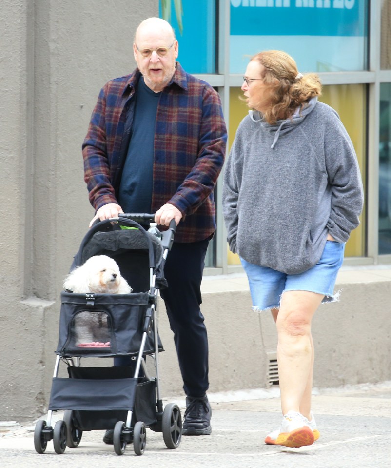 **Exclusive** Billionnaire Manchester United FC owner Avram Glazer is seen with his wife Jill Henkin as they push a pram for their dog around New York City. New Yorker's passing by would never know the couple are worth a billion dollars in their extremely humble clothes. The dog looked pretty happy to be pushed around like a baby. Credit- Probe-Media.com