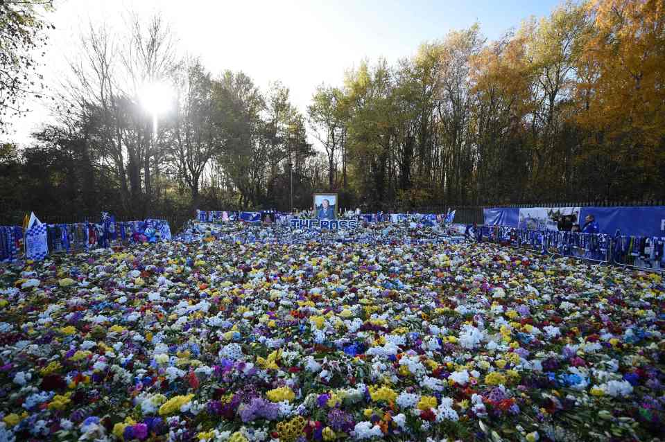 Floral tributes left for Leicester City's late owner Vichai Srivaddhanaprabh, are pictured ahead of the club's English Premier League football match against Burnley, at the King Power Stadium in Leicester, central England on November 10, 2018. - Leicester City are to pay an emotional tribute to late owner Vichai Srivaddhanaprabha on Saturday as the club play at their King Power Stadium for the first time since his death in a helicopter crash. The charismatic Thai had become a beloved figure in the club and the city -- a feat rarely achieved by Premier League clubs' often distant billionaire owners. Around 5,000 fans were expected to walk from the city centre to the stadium before the Premier League match against Burnley. (Photo by Oli SCARFF / AFP)OLI SCARFF/AFP/Getty Images