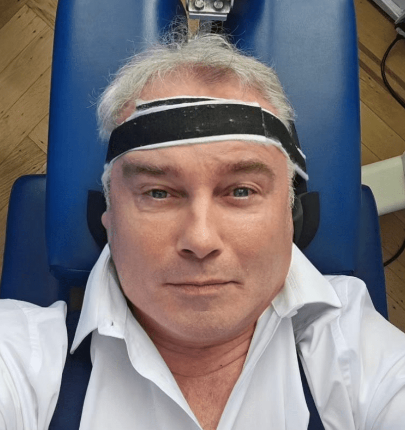 He had a band wrapped around his forehead as he underwent a spine decompression