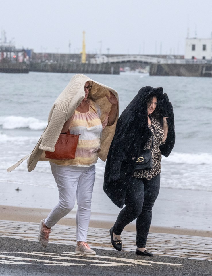 People shielded from the harsh conditions in Scarborough, North Yorkshire, yesterday