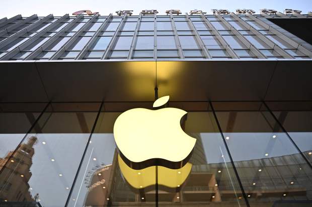 an apple logo is on the side of a building