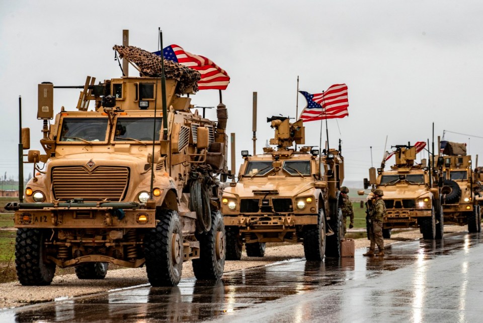 American soldiers patrol on the M4 highway in the town of Tal Tamr in the northeastern Syrian Hasakeh province on the border with Turkey on January 24, 2020. (Photo by Delil SOULEIMAN / AFP) (Photo by DELIL SOULEIMAN/AFP via Getty Images)