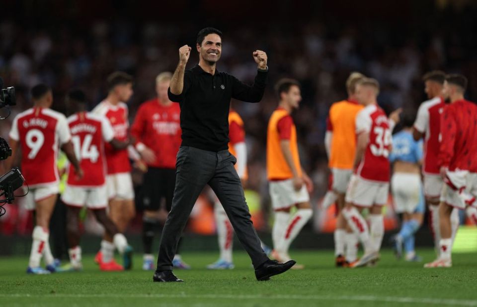 Arsenal's Spanish manager Mikel Arteta celebrates their victory on the pitch after the English Premier League football match between Arsenal and Manchester City at the Emirates Stadium in London on October 8, 2023. Arsenal won the game 1-0. (Photo by Adrian DENNIS / AFP) / RESTRICTED TO EDITORIAL USE. No use with unauthorized audio, video, data, fixture lists, club/league logos or 'live' services. Online in-match use limited to 120 images. An additional 40 images may be used in extra time. No video emulation. Social media in-match use limited to 120 images. An additional 40 images may be used in extra time. No use in betting publications, games or single club/league/player publications. /  (Photo by ADRIAN DENNIS/AFP via Getty Images)