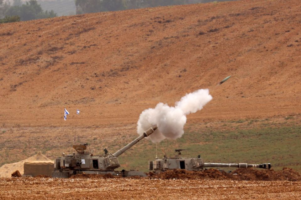 Artillery shells are fired from an undisclosed position toward the Gaza Strip by the Israeli army on October 29, 2023. Israel pounded Hamas-ruled Gaza with more air and ground attacks on October 29 in an escalating military campaign as the UN warned civil order was "starting to break down" in the besieged Palestinian territory. (Photo by Gil COHEN-MAGEN / AFP) (Photo by GIL COHEN-MAGEN/AFP via Getty Images)