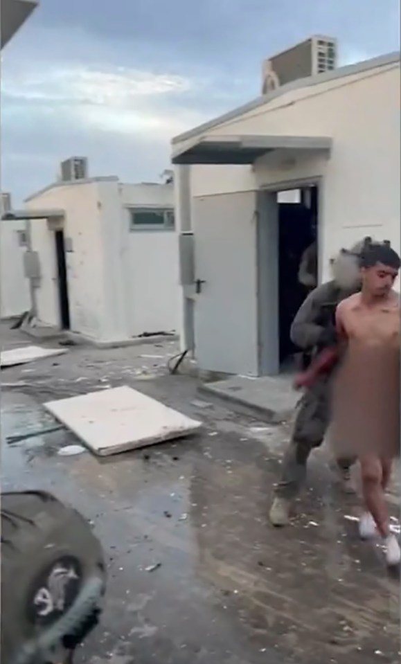 They can be seen hauling out a bloodied man in handcuffs
